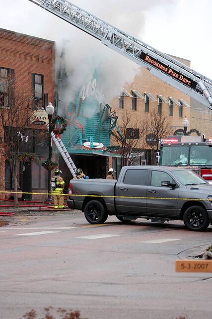 Firefighters battle the blaze at Brosts Fashions on Dec. 30, 2024. It ruined the business on Main Avenue in downtown Brookings, along with several neighboring shops and apartments.
                                 Mondell Keck/Brookings Register file photos