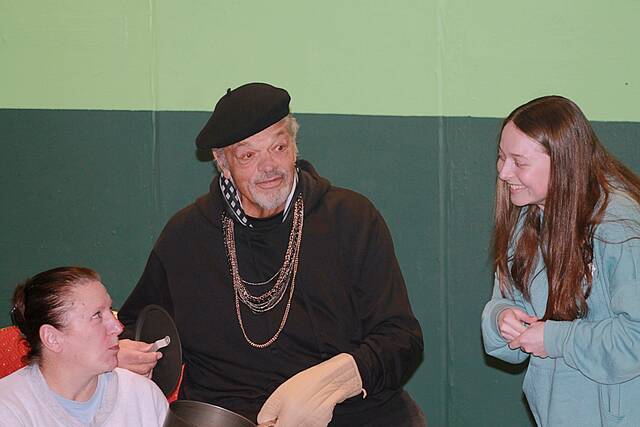 From left: Kelcy Nash (Mrs. Banks), Stu Melby (Victor Velasco), and Magdalen Eberle (Corie Bratter) discuss their lines during a rehearsal of Barefoot in the Park, staged by the Brookings Community Theatre players and opening Thursday in the Fishback Studio Theatre in the Larson Performing Arts Center. (John Kubal/Brookings Register)