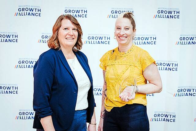 Devin Anderson of Craft Chophouse & Lounge in Brookings received the Peoples Choice Dessert Award from BRGA CEO Lori Frederick.