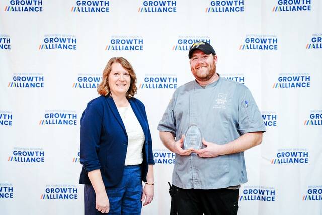 John Harvey of the Dakotah Bank Center received the Golden Fork Award from BRGA CEO Lori Frederick.