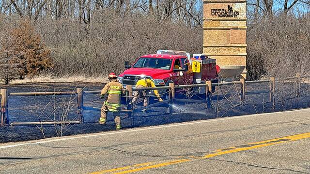 Firefighters battled not only flames but high winds as well during an April 12 grass fire at Dakota Nature Park.
                                 Alex Post/AP Media & Filming