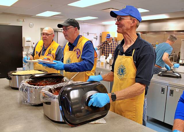Mike Springer, Greg Dargen and Brad Farber dish out spaghetti on April 19 during the Brookings Lions Clubs annual spaghetti dinner. Proceeds from the meal go to support a number of Lions projects throughout the region.
Brian Bloom/Brookings Register