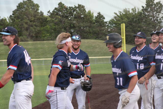 Gavin Struve | The Brookings Register
The Cubs celebrate Michael Zimmermans home run in their June 15 win.