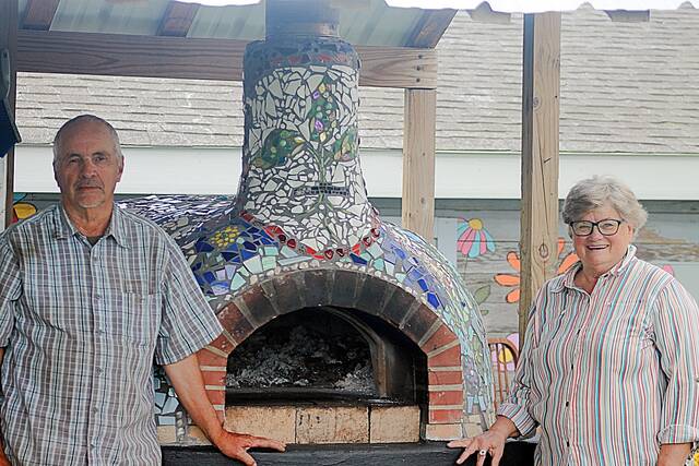 Bill and Julie Ross are proud of their colorfully decorated pizza oven, which turns out hundreds of pizzas. Every Sunday from 4:30 to 7:30 p.m. now until Oct. 4 is Pizza Night. Order on their website.
John Kubal/Brookings Register
